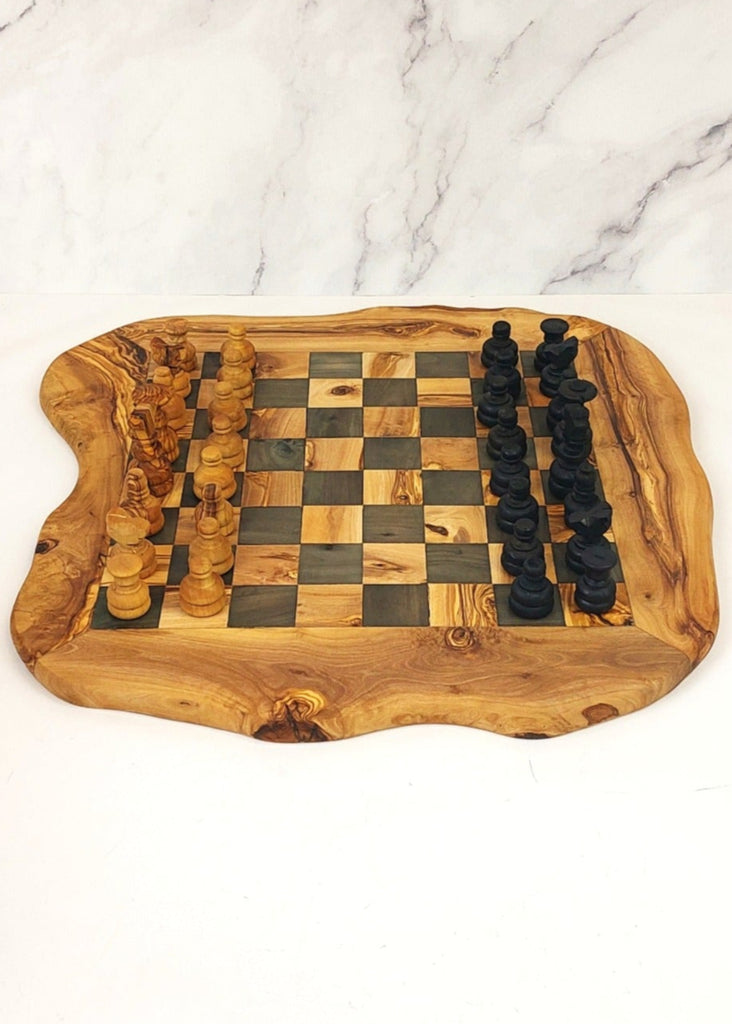 an olive wood chess board featuring black and brown squares, paired with handcrafted black and brown olive wood chess pieces