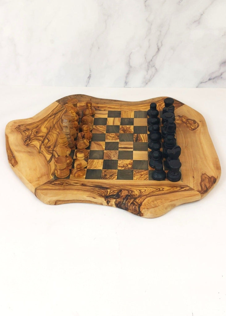 an olive wood chess board featuring black and brown squares, paired with handcrafted black and brown olive wood chess pieces