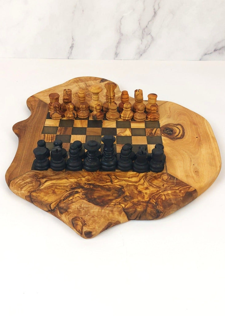 an olive wood chess board featuring black and brown squares, paired with handcrafted black and brown olive wood chess pieces