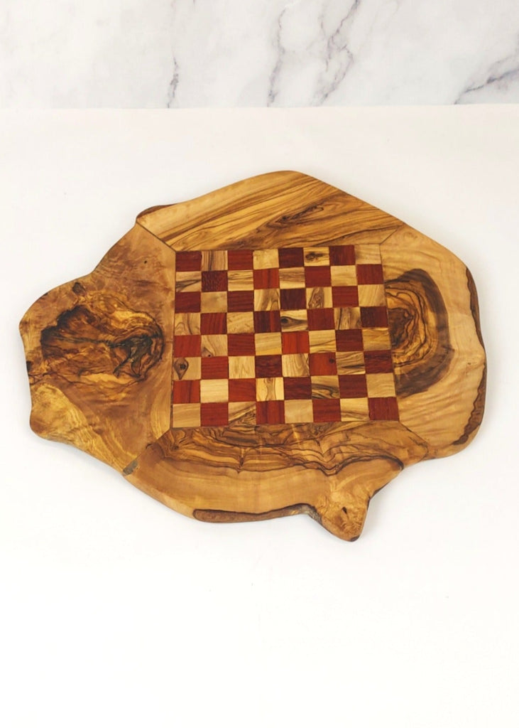 an olive wood chess board featuring red and brown squares, paired with handcrafted black and brown olive wood chess pieces