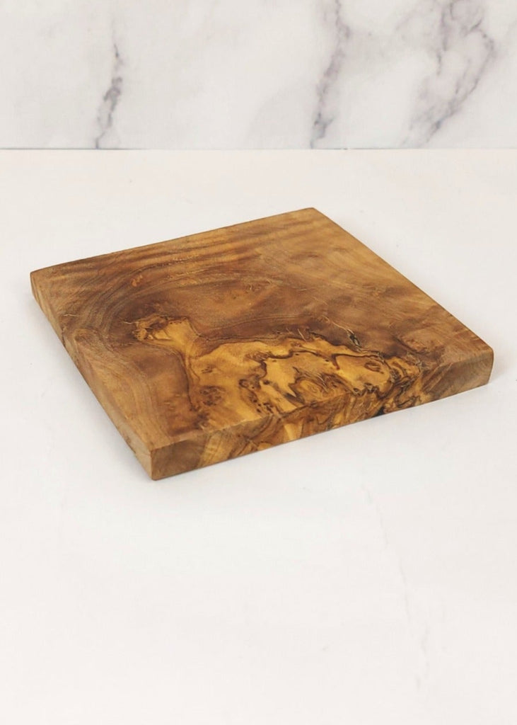 A square olive wood coasters, featuring a unique natural grain pattern